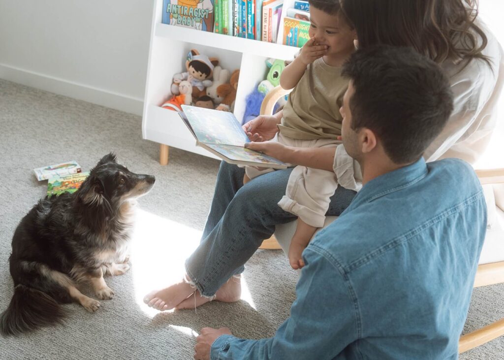 family reading with toddler at home
