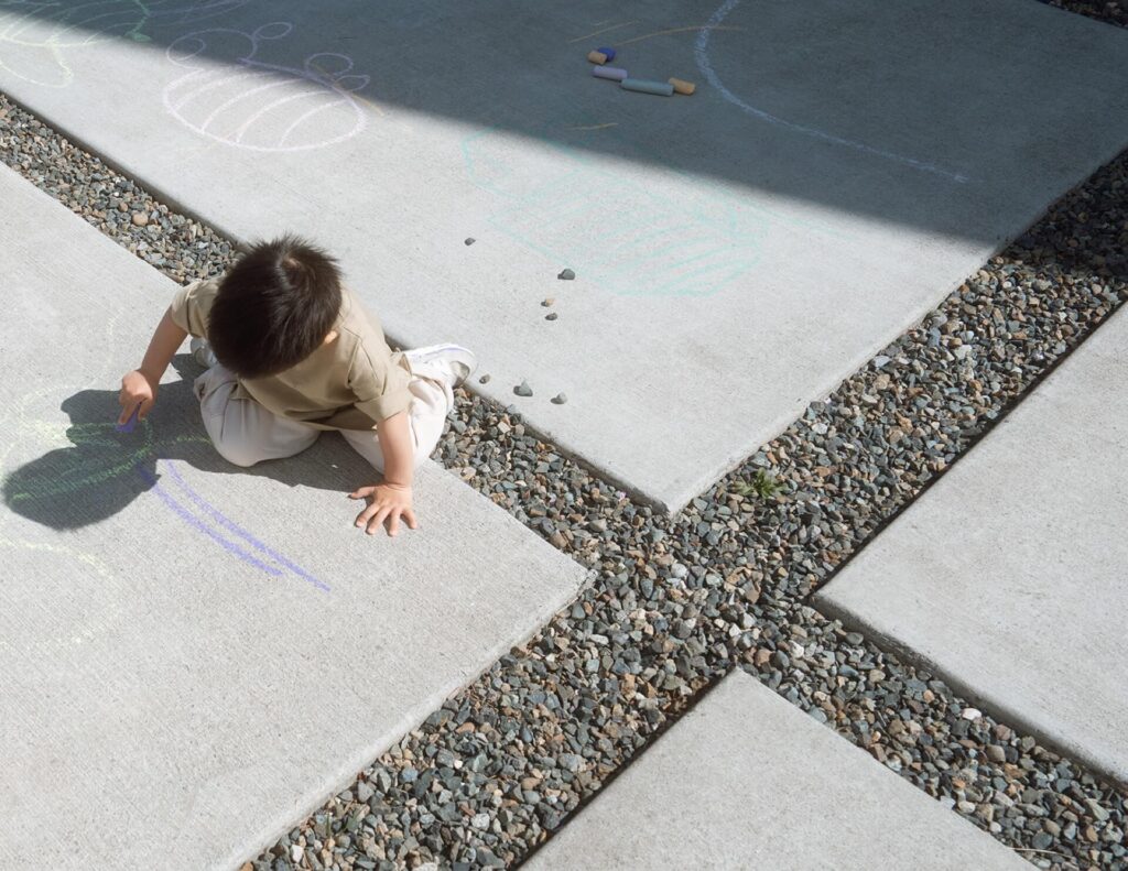toddler playing with chalk in west seattle