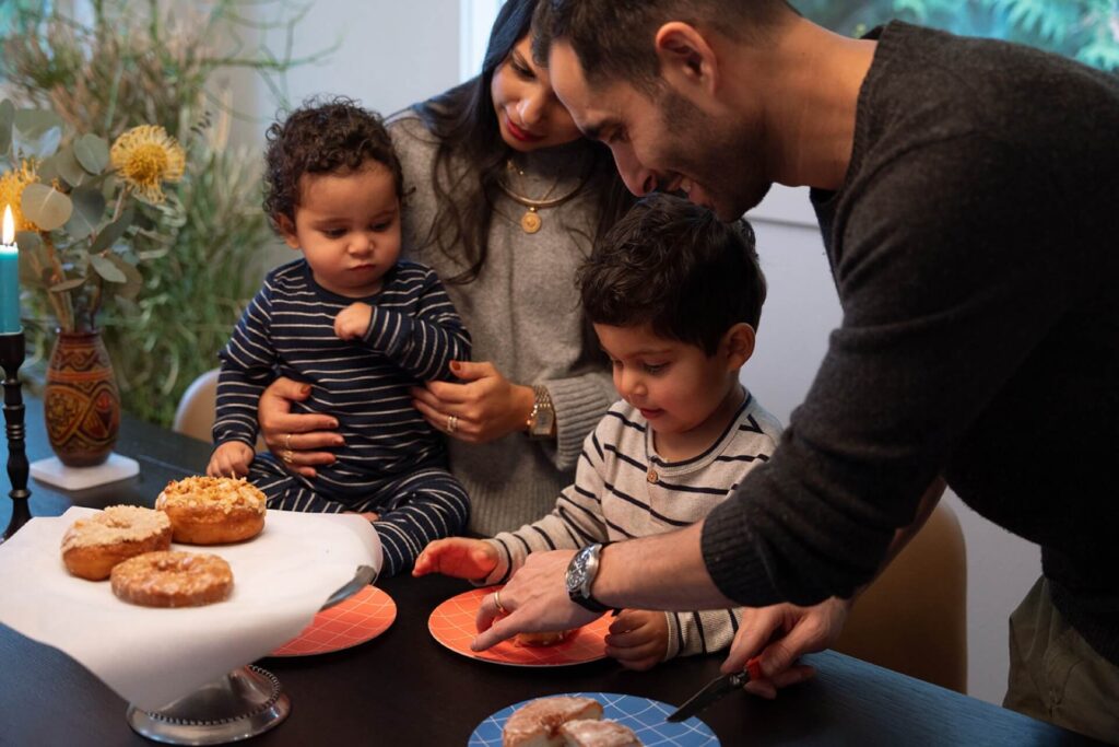 family eating donuts with kids in seattle home