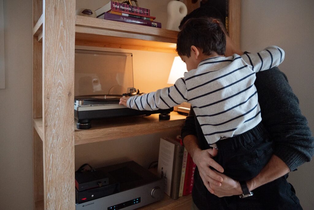 boy setting record on player with father