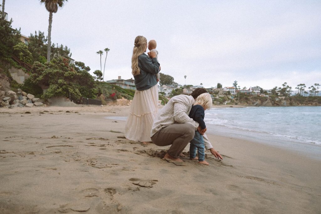 family of four at laguna beach with two small children