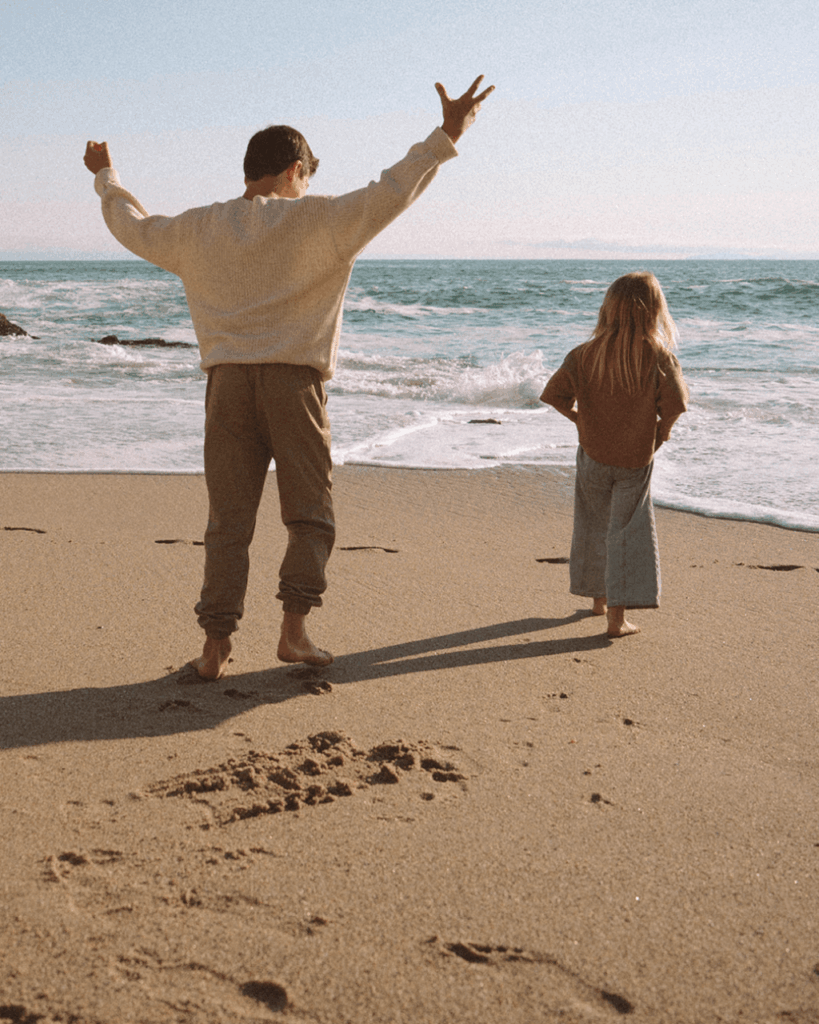 kids walking on beach in laguna