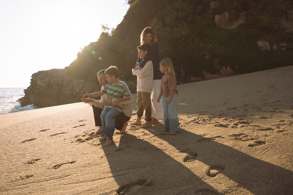 mother and father with three kids at tablerock beach