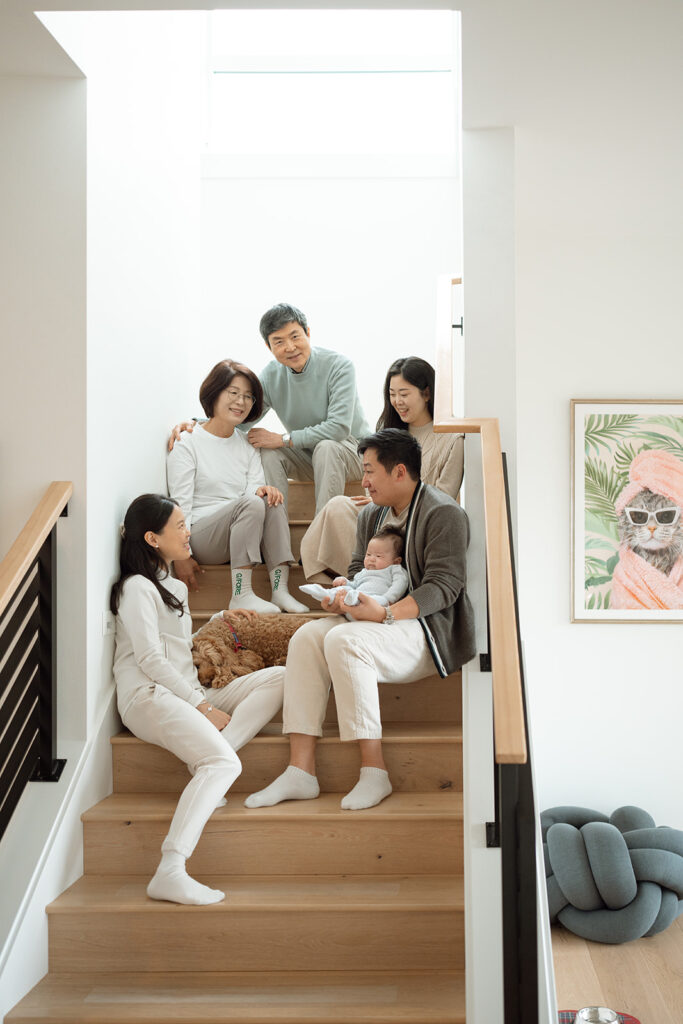 Multigenerational family at home with newborn baby during an in-home session in Irvine.