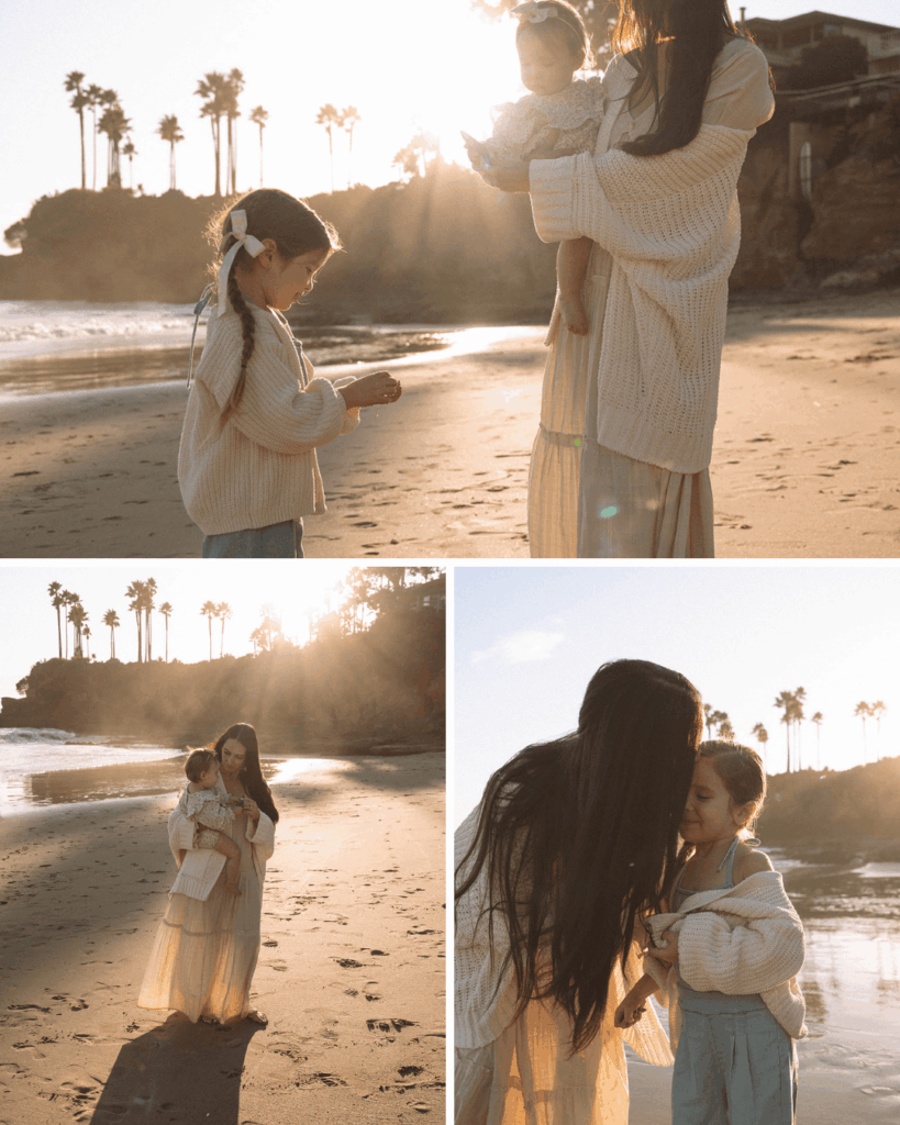 Soft golden light over a mother and her young kids sharing a quiet beach moment in Laguna Beach, CA.