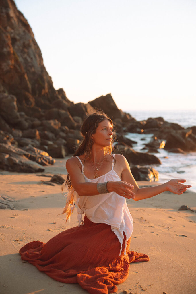 Portrait of a wellness entrepreneur during her Laguna Beach branding photos session, photographed at sunset with warm golden light.