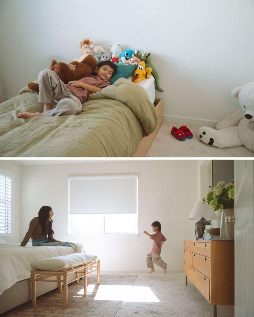 A young boy jumping in a sunlit bedroom while his mom watches during an Irvine lifestyle family session.
